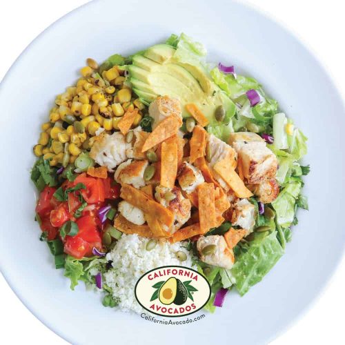 Fresh fish taco salad with avocado, corn, and vegetables at Wahoo's.