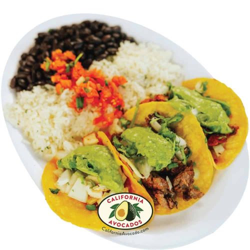 Delicious fish tacos with avocado, rice, beans, and fresh toppings at Wahoo's.